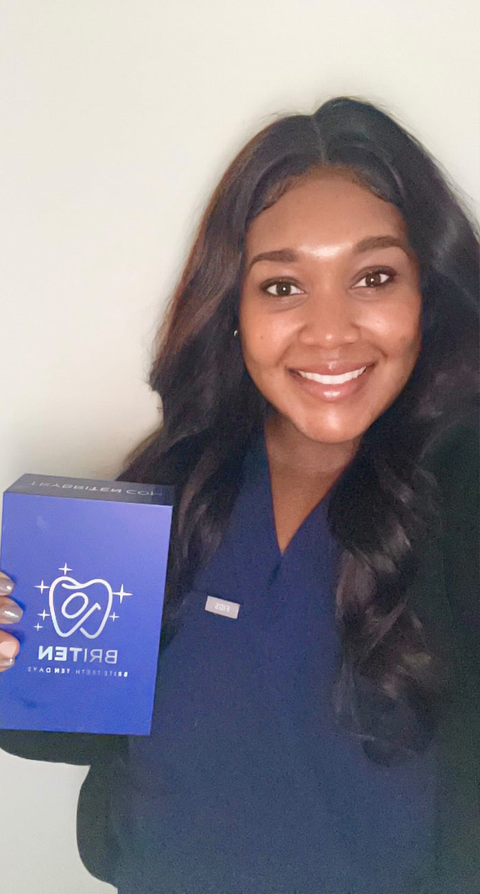 Sarah A., registered dental hygienist, in scrubs holding her BRITEN whitening kit