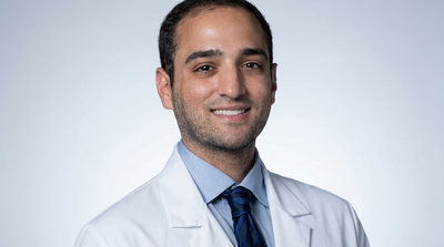 Dr. Ryan Chaliff, DDS, MD, practicing dentist and co-founder of BRITEN, in a white coat
